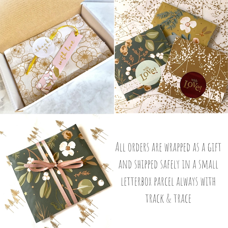May include: A gift-wrapped parcel in a white box featuring gold floral tissue paper, a pink tag with the text with love, and a white thank you sticker. Other packages are wrapped in dark green botanical paper with ribbons and stickers.