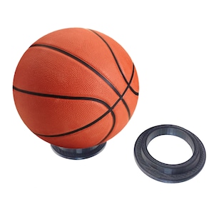 May include: A basketball on a clear acrylic stand with a black ring for display.