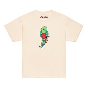 May include: A beige t-shirt featuring a colourful illustration of a bird with a red belly and green and blue feathers. The text "Red Belly" is printed on the neck of the shirt.