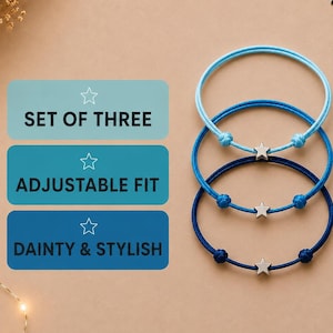 May include: A set of three adjustable bracelets in varying shades of blue, each featuring a small silver-toned star charm. The text on the image reads: SET OF THREE, ADJUSTABLE FIT, DAINTY & STYLISH. The bracelets are arranged vertically.