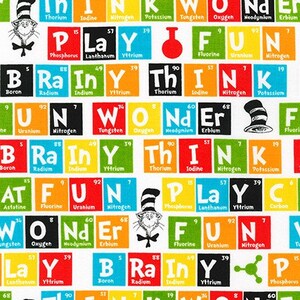 May include: A white fabric with a colorful pattern of squares featuring the periodic table elements and the words "Think", "Play", "Fun", "Brain", "Rainy", "Wonder", and "Cat in the Hat".