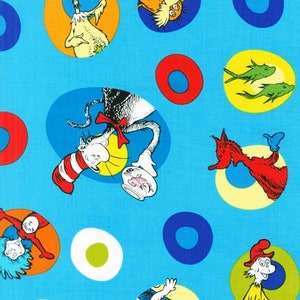 May include: A blue fabric with a repeating pattern of colorful circles and characters from the book "The Cat in the Hat". The characters include the Cat in the Hat, Thing 1, Thing 2, and the Fish.