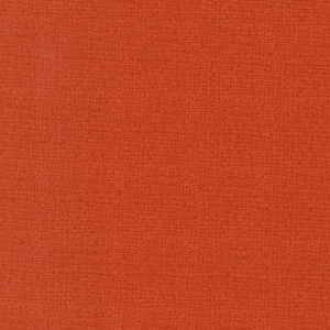 May include: A close-up of a textured, orange fabric with a subtle woven pattern.