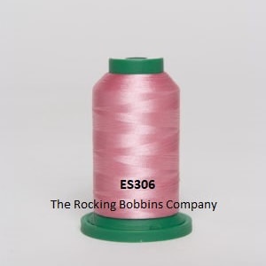 May include: A spool of pink embroidery thread with a green label that reads "ES306 The Rocking Bobbins Company".