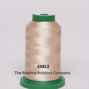 May include: A spool of beige thread with a green plastic bobbin and the text "ES812 The Rocking Bobbins Company" printed on the label.