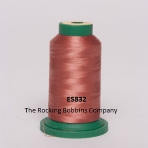 May include: A spool of salmon-colored thread with a green plastic bobbin. The spool is labeled "ES832" and "The Rocking Bobbins Company".
