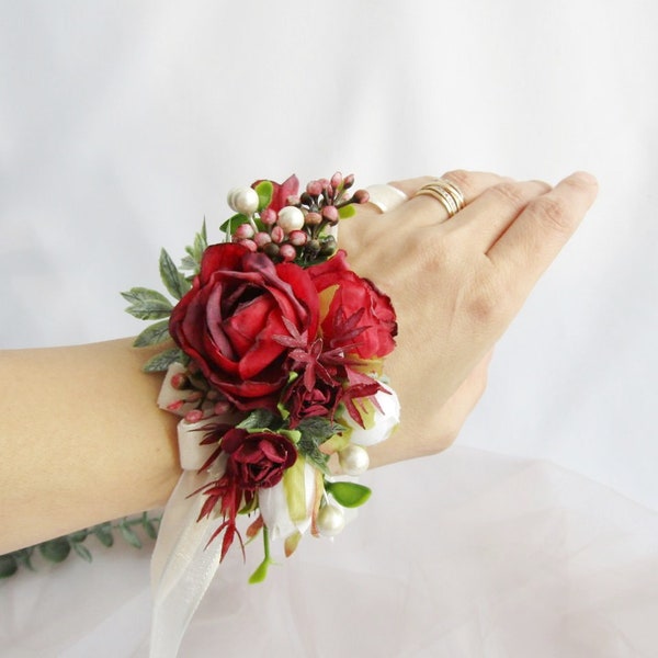 White and red floral bracelet. Burgundy rose bridal wrist corsage. Red groom buttonhole. Bridesmaid gift. Red Grooms boutonniere