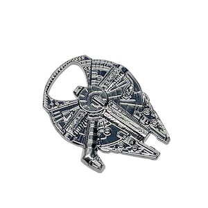 May include: Silver metal bottle opener shaped like the Millennium Falcon spaceship from Star Wars.