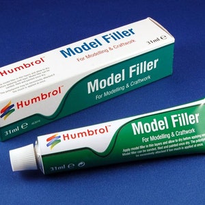May include: A tube of Humbrol Model Filler for modeling and craftwork. The tube is green and white with the brand name and product name printed on it. The tube is 31 ml.