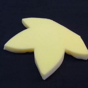 May include: A yellow foam star-shaped cushion with five points.