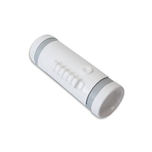 May include: White cylindrical container with a gray band and a series of raised ridges on the side. The container has a small round button on the top.