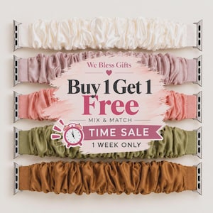 May include: Five scrunchie-style watch bands in cream, dusty rose, coral, olive green, and copper, each with silver metal connectors. A central graphic overlay displays the text: We Bless Gifts, Buy 1 Get 1 Free, MIX & MATCH, TIME SALE, 1 WEEK ONLY.