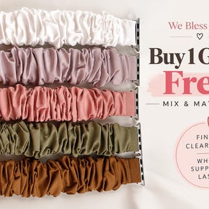 May include: Five scrunchie-style watch bands in white, dusty rose, salmon pink, olive green, and brown, each featuring metallic silver connectors. Text on the right reads: We Bless Gifts, Buy 1 Get 1 Free, MIX & MATCH, FINAL CLEARANCE, WHILE SUPPLIES LAST.