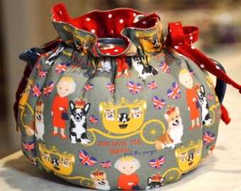 TEA COSY XS Plus fits your 18-22 Oz teapot is made with Quirky Queen (Elizabeth) fabric and lined in red and white dot cotton