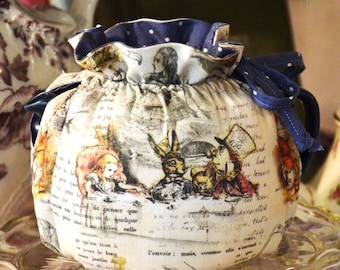 TEA COSY XS Plus fits a 18-22 Oz teapot.  Photos show the cosy on 2 different teapots in Alice In Wonderland Book cotton fabric
