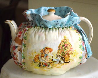 TEA COSY Small Size fits a 24-30 Oz teapot is made with Tasha Tudor Art Panels over corgi dog fabric lined with robin's egg blue cotton