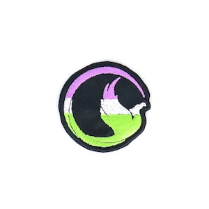 May include: A round, embroidered patch with a green, white, and purple design. The design is a stylized bird in flight.