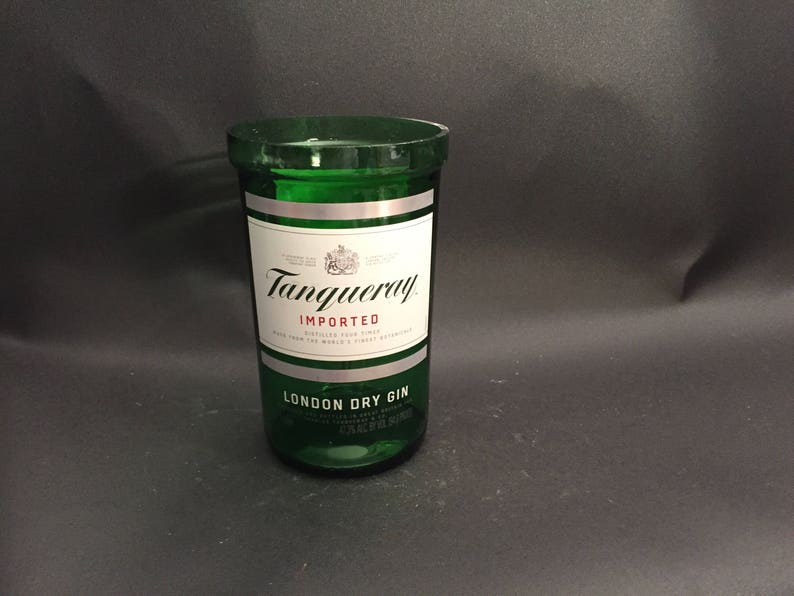 May include: A green glass bottle with a silver label that reads "Tanqueray Imported London Dry Gin".