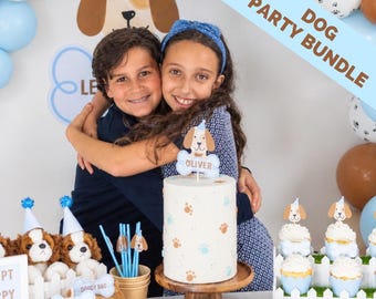 May include: A dog-themed party bundle featuring a cylindrical cake with paw print patterns and a custom bone-shaped topper reading Oliver. Includes plush dog toys, blue paper straws with dog cutouts, and cupcakes in blue wrappers with dog toppers.