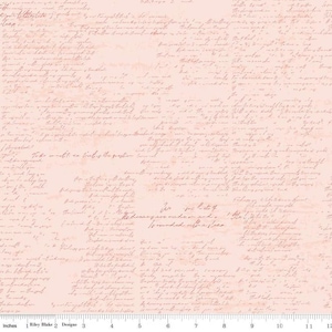 May include: A fabric with a light pink background covered in faded, handwritten script. The script is in a darker shade of pink, creating a vintage aesthetic. The bottom of the fabric has a ruler with inches. The text "Riley Blake Designs" is visible.