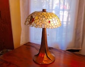 Beach Glass Lamp. This one of a kind Beach Glass Lamp is multi-coloured with a stunning copper base, hammered cap and finial.