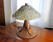 Beach Glass Lamp. This one of a kind Beach Glass Lamp is multi-coloured with a stunning copper base, hammered cap and finial.