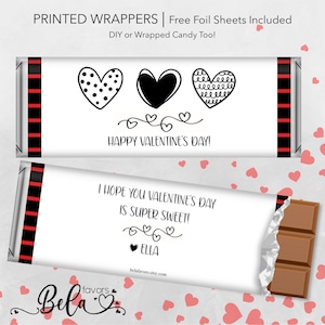 May include: Printable Valentine's Day chocolate bar wrappers with black and white hearts and the text "Happy Valentine's Day!" and "I hope you Valentine's Day is super sweet!" with the name "Ella" on the bottom.