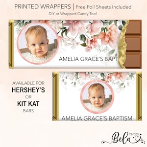May include: Printable chocolate bar wrappers with a floral design and a photo placeholder. The text on the wrapper says "Amelia Grace's Bapt" and "Amelia Grace's Baptism".