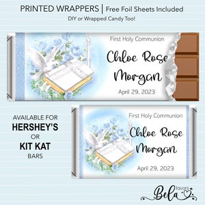 May include: Printable wrappers for Hershey's or Kit Kat candy bars, featuring a blue and white design with a dove, a book, and roses. The text reads "First Holy Communion Chloe Rose Morgan April 29, 2023".