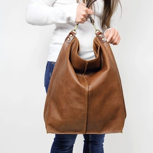 Upgrade your everyday style with this handmade oversized leather tote bag, designed to hold everything you need while staying effortlessly chic.