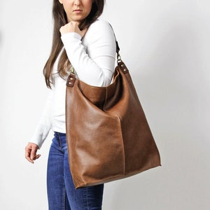 Large brown leather hobo bag.