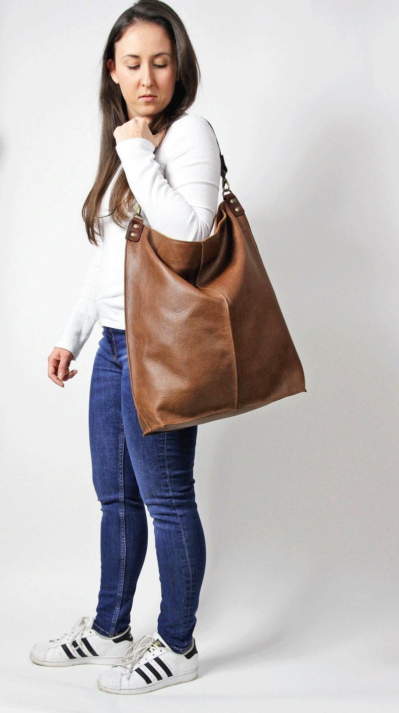 Large brown leather hobo bag.