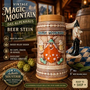 May include: A ceramic beer stein featuring a raised relief design of a bearded figure with a green hat holding two mugs. The stein has a handle shaped like a wizard and the text MAGIC MOUNTAIN. It measures 7 inches tall and 5 inches wide.