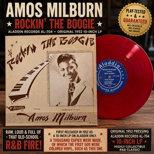 May include: A 10-inch vinyl record titled Rockin' the Boogie by Amos Milburn on the Aladdin label. The tan album cover features a black and white portrait of the artist and a piano keyboard graphic. The record itself is a solid, translucent red color.