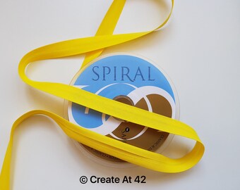 Ruban adhésif polycoton 18 mm à reliure en biais jaune vif, spirale Safisa par mètre plié