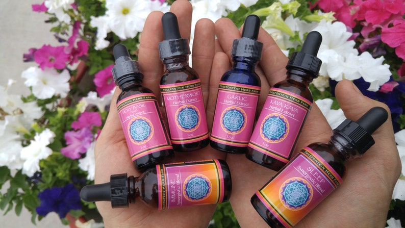 May include: Six small glass bottles with dropper tops, each containing a different herbal extract. The bottles are labeled with the names of the herbs, including "Garlic", "Kava Kava", "Sleep", "Motherwort", "Holy Basil", and "Turmeric".