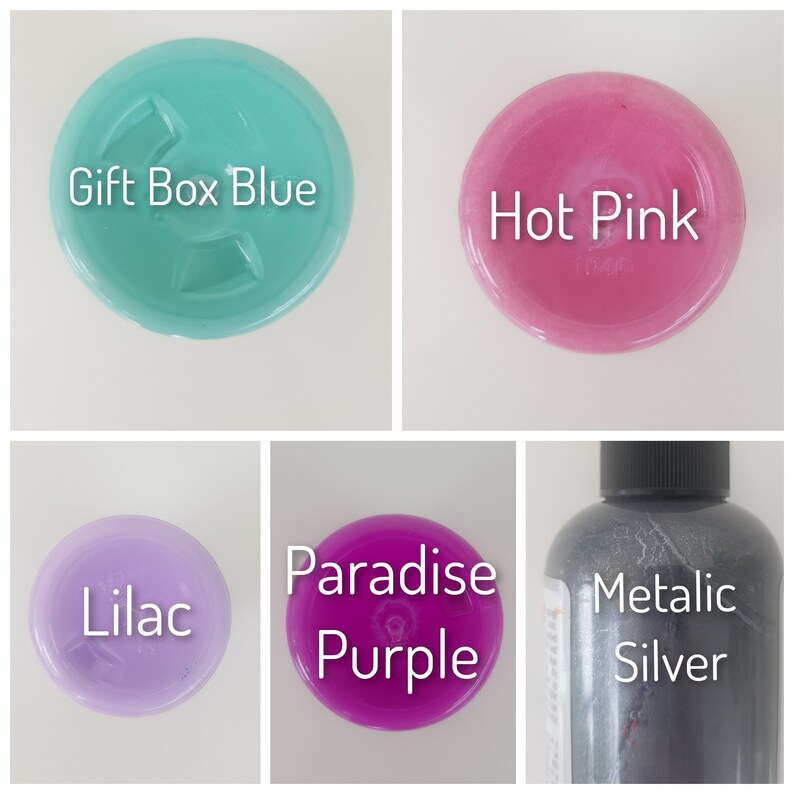 May include: Five bottles of paint in different colors: lilac, hot pink, gift box blue, paradise purple, and metallic silver.