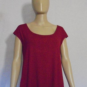 May include: A maroon scoop neck top with short sleeves. The top is made of a soft, stretchy fabric and has a relaxed fit.