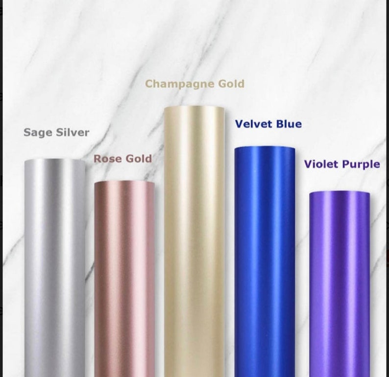 May include: Five different colored vinyl rolls, from left to right: Sage Silver, Rose Gold, Champagne Gold, Velvet Blue, and Violet Purple.