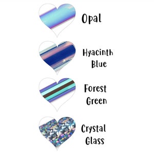 May include: Four heart-shaped images with different iridescent finishes. The top image is labeled "Opal", the second image is labeled "Hyacinth Blue", the third image is labeled "Forest Green", and the bottom image is labeled "Crystal Glass".