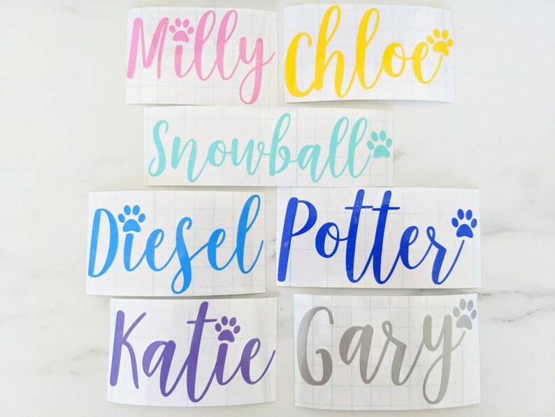 May include: Six personalized pet name decals with paw prints. The names are Milly, Chloe, Snowball, Diesel, Potter, and Gary. The decals are on a white background.