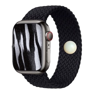 May include: A black smartwatch with a braided band and a zebra print watch face. The watch has a silver case with a red accent on the side button and a white clasp.