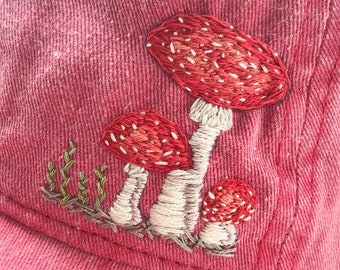 mushaboom : a hand embroidered mushroom on red baseball hat, one of a kind