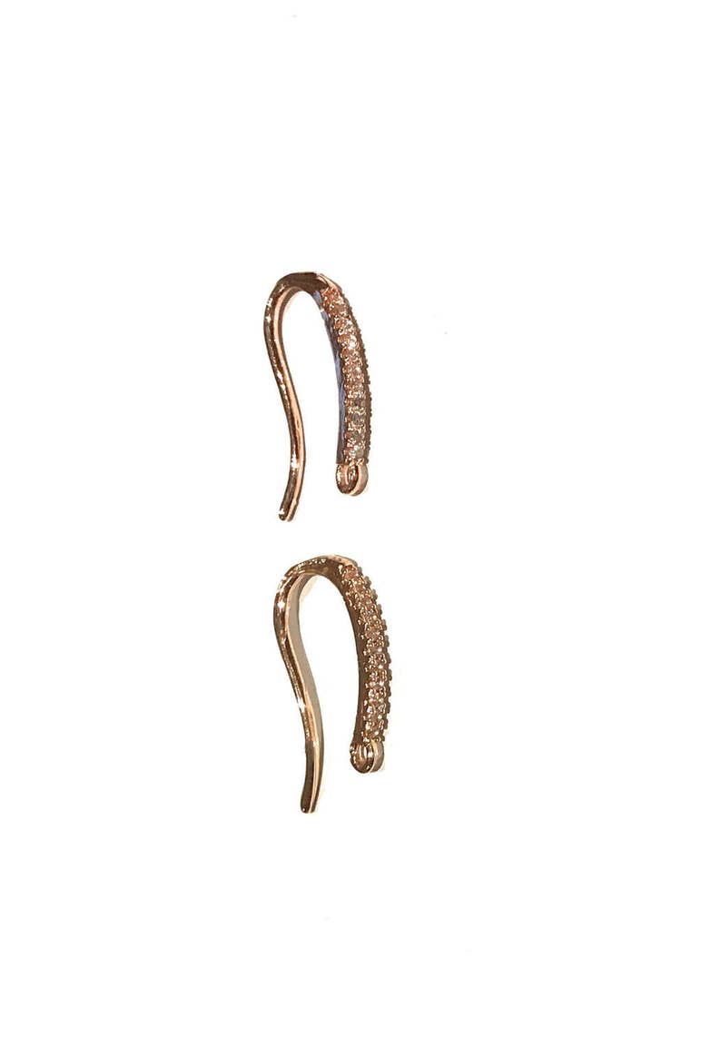 May include: Two gold-tone earring hooks with clear crystal accents.