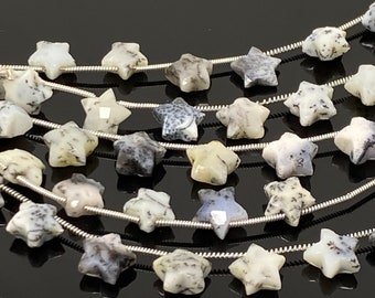 May include: A strand of star-shaped gemstone beads, featuring a white and grey colour scheme with a speckled pattern. The beads are strung on a silver wire.