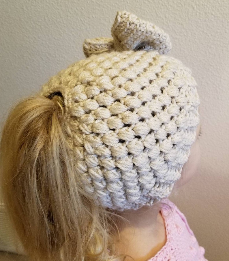 Crochet childs bun beanie ponytail winter hat linen off white cream kids girls with detachable hair bow
