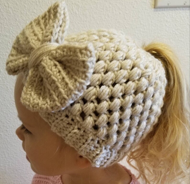 Crochet childs bun beanie ponytail winter hat linen off white cream kids girls with detachable hair bow