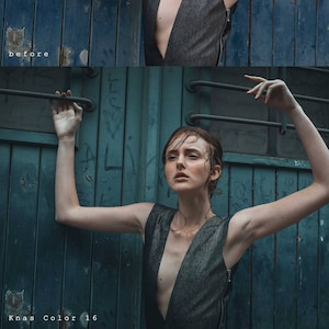 May include: A woman wearing a black sleeveless dress with a plunging neckline stands in front of a weathered blue door with metal bars. Her hair is wet and she has a serious expression on her face.