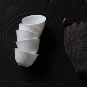 A Set of Five White Porcelain Chinese Tea Cups