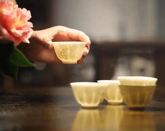 A Set of Five White Porcelain Plum Flower Chinese Tea Cups
